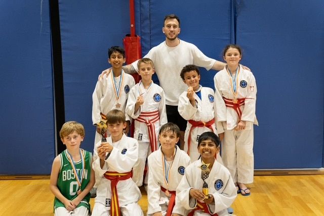 Group of young Core Judo Staines athletes with medals and trophies after competition
